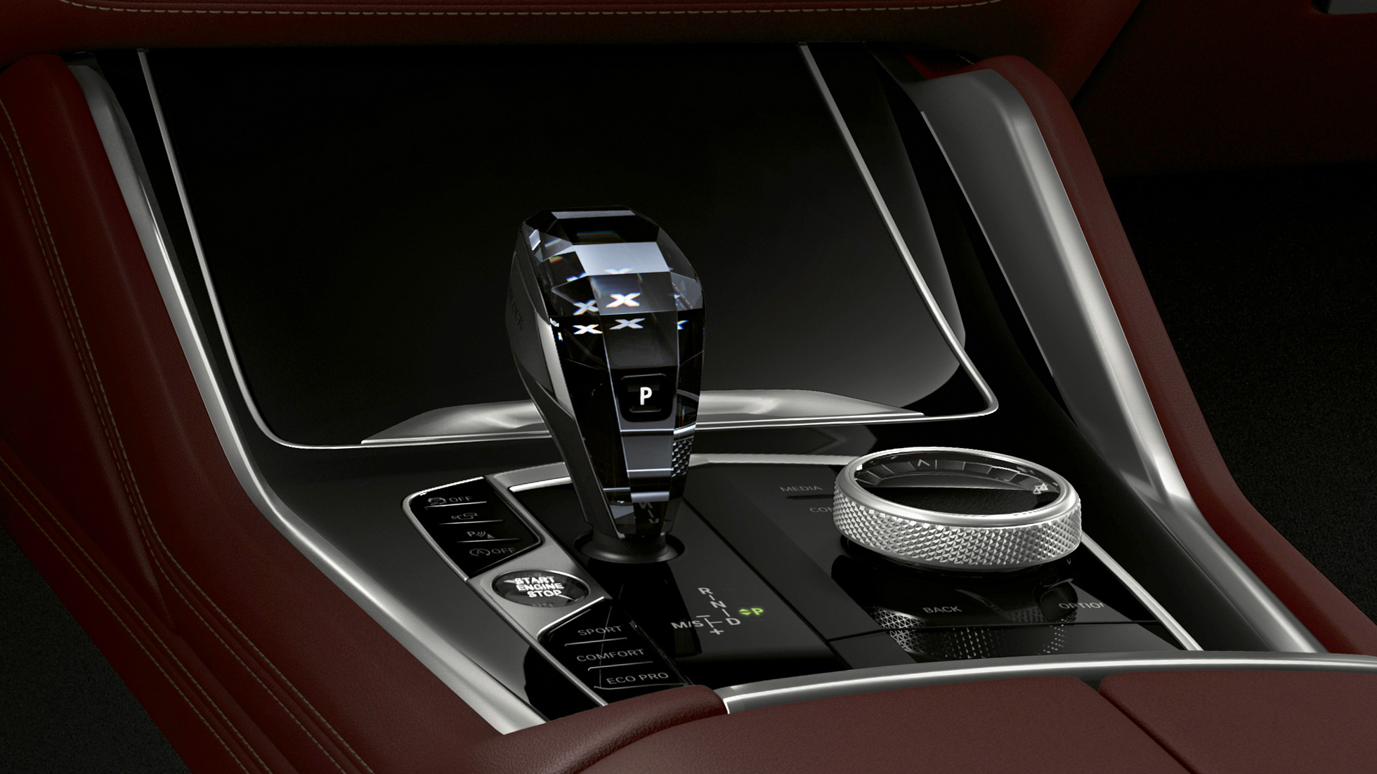 BMW X6 s opcijom opreme BMW Individual, središnja konzola. Unutrašnjost BMW-a X6 s opcijom opreme BMW Individual s fokusom na središnju konzolu.